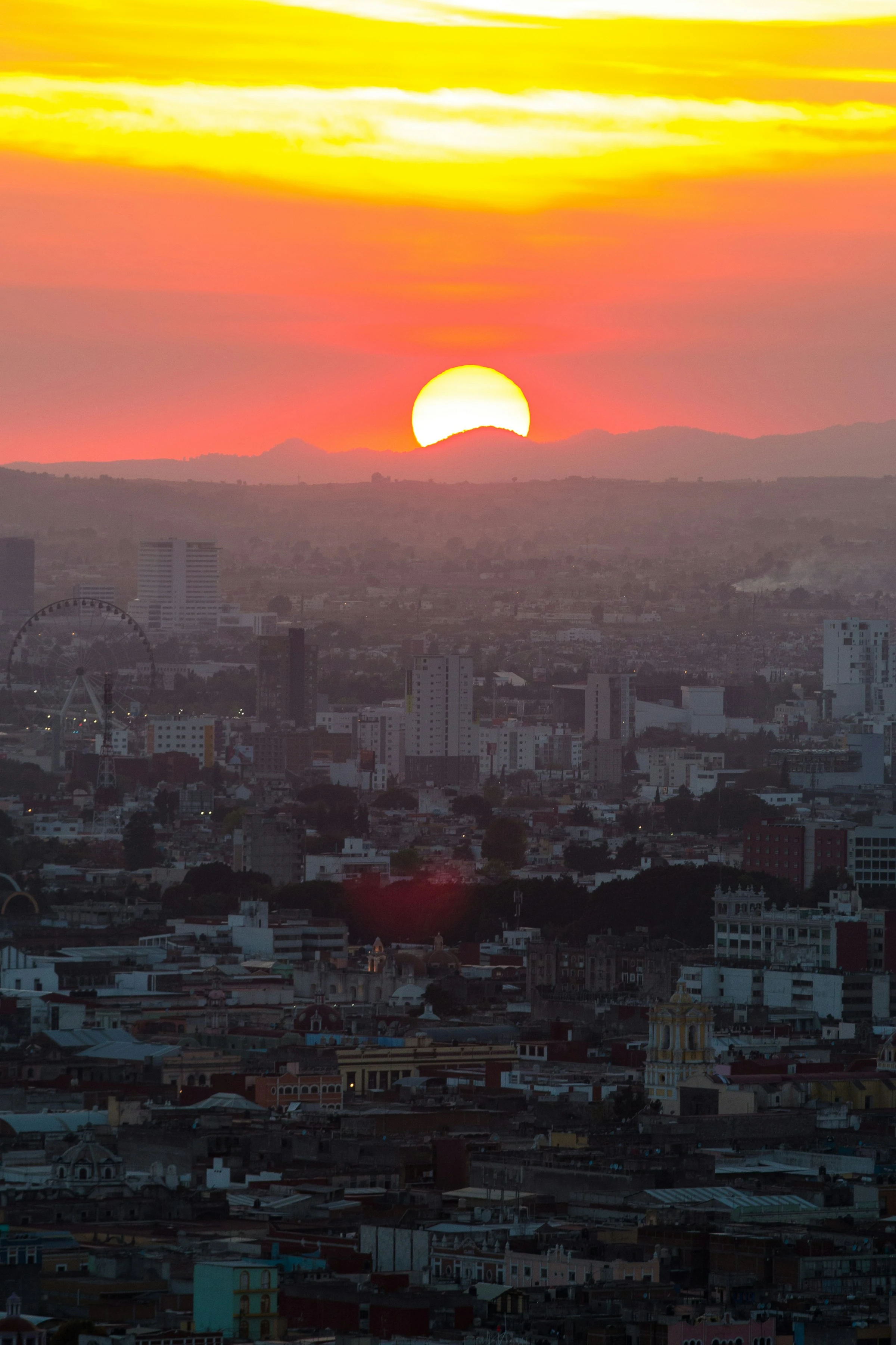Golden sunset over the rooftops and skyline of Puebla, Mexico