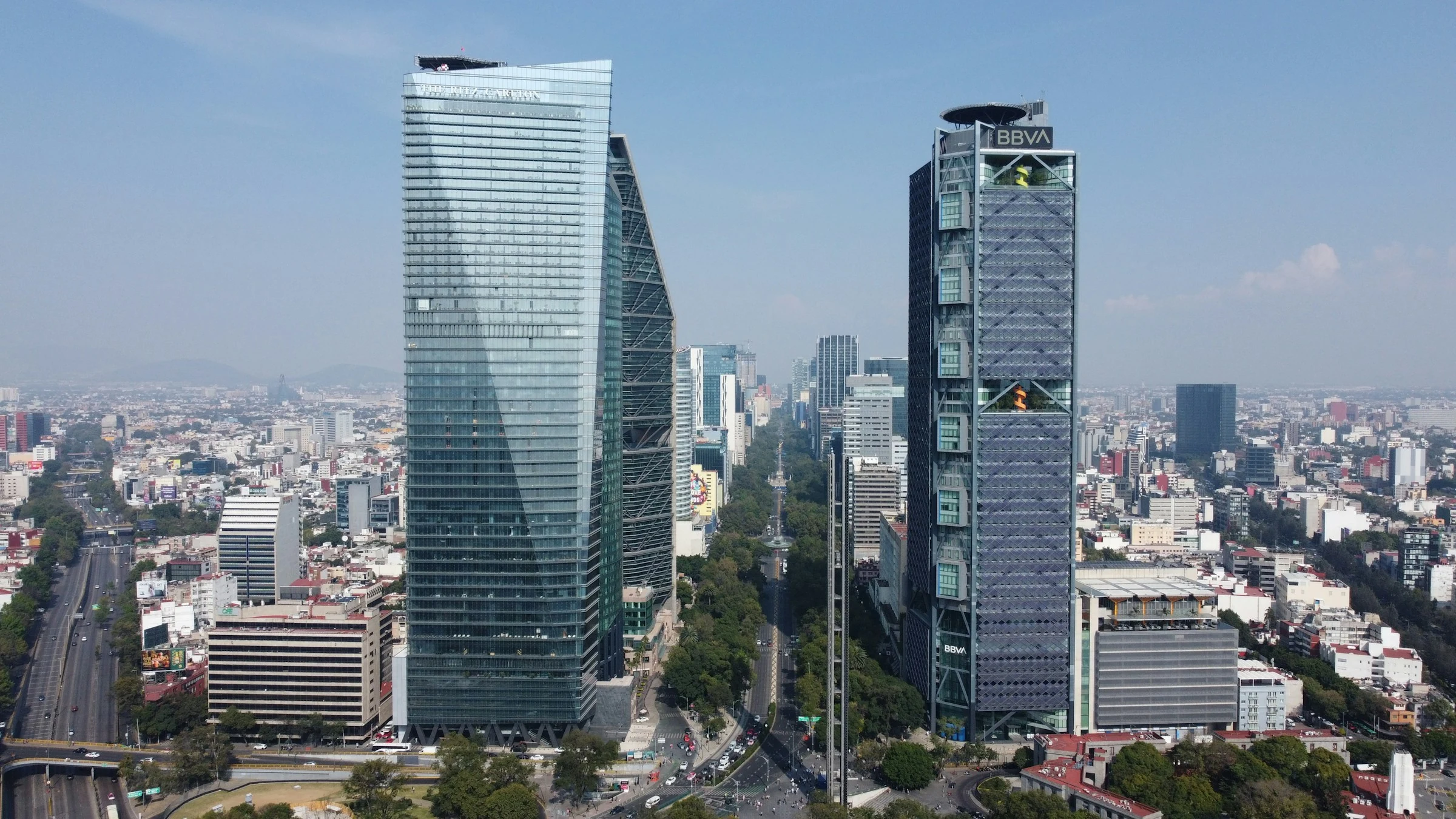 Torre Reforma and BBVA tower above the tree-lined Paseo de la Reforma in Mexico City